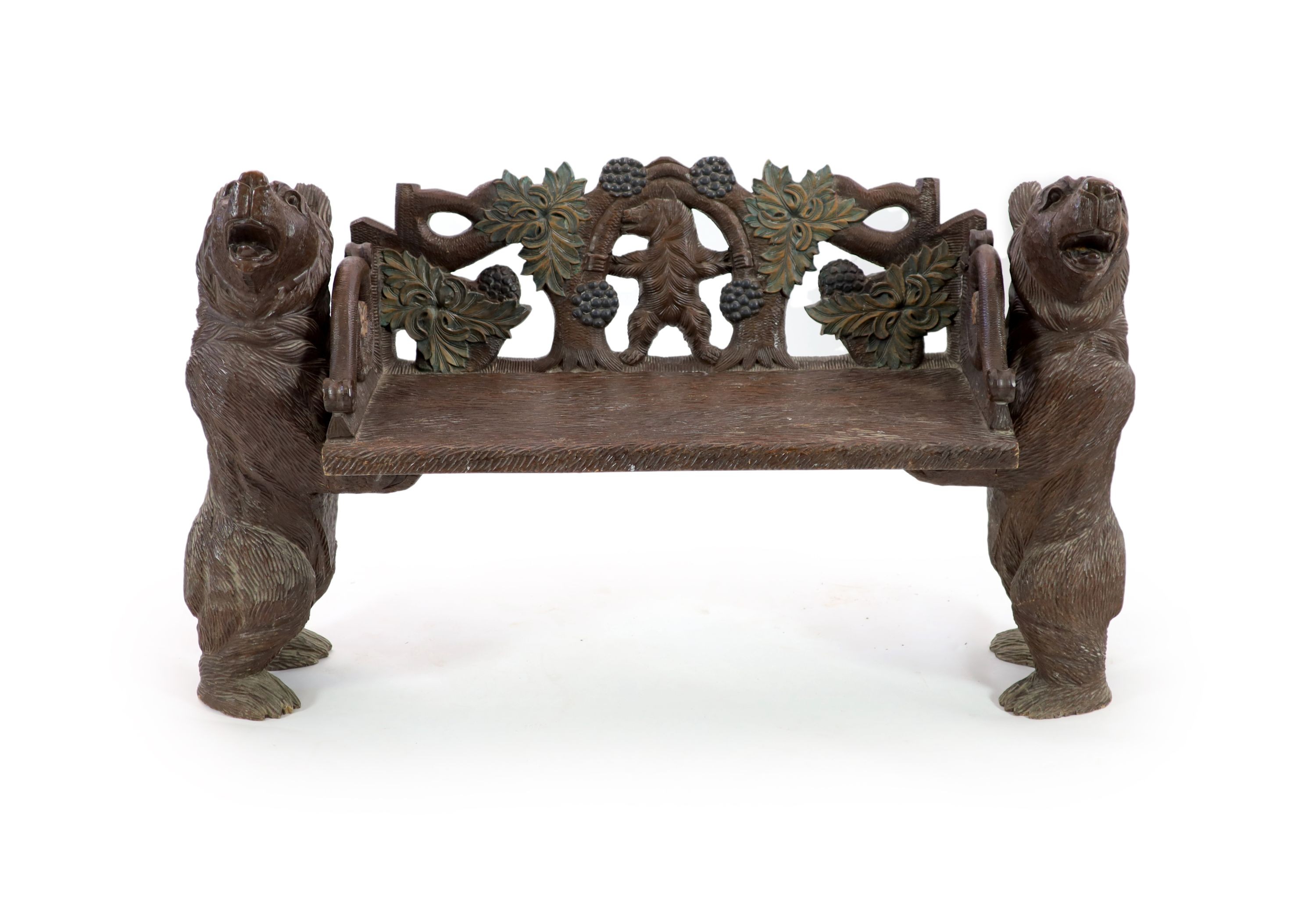 An early 20th century Black Forest carved wood bear hall seat, W.162cm D.52cm H.95cm